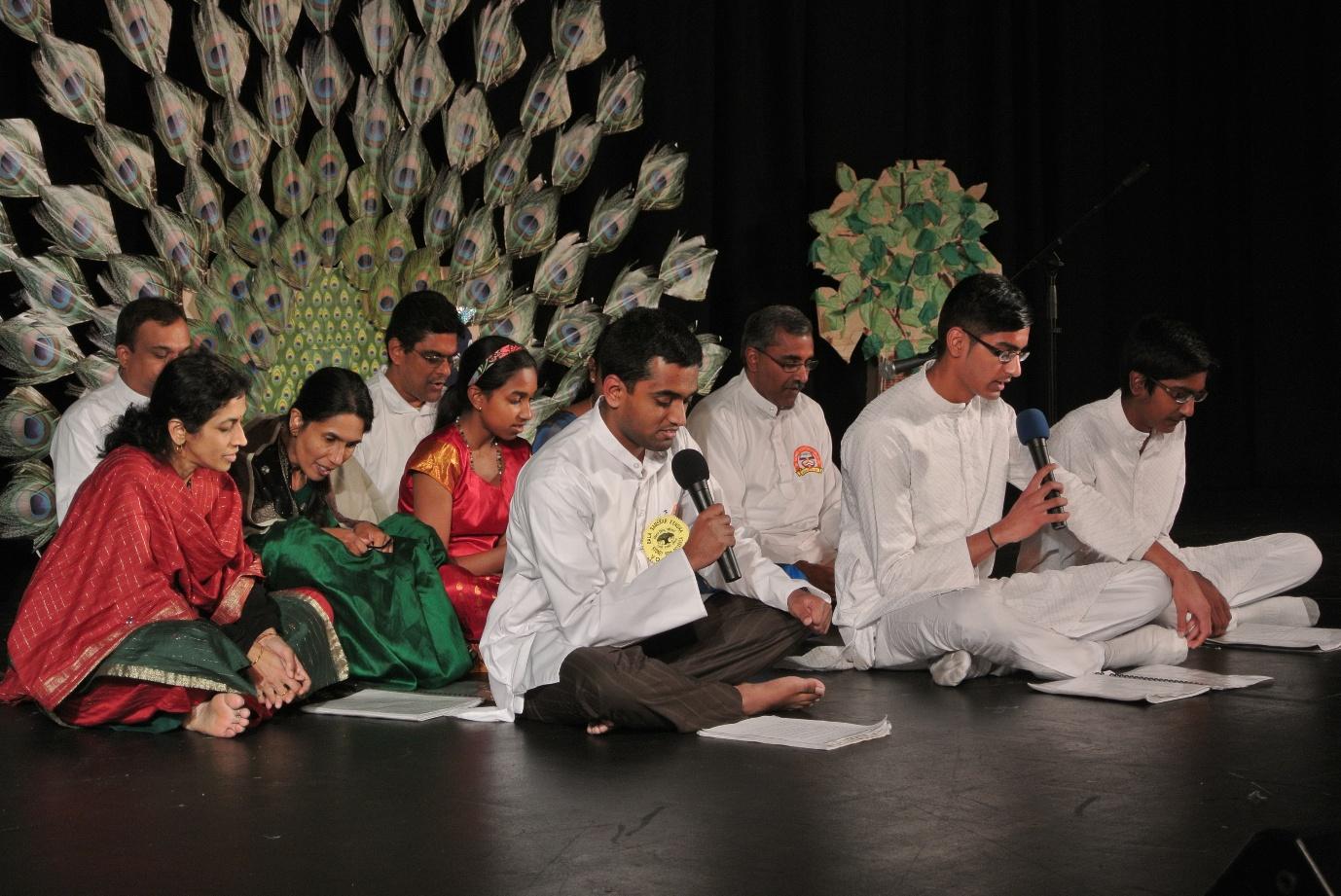Students performing at public events — reciting Vedic texts and poems